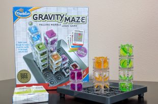 Gravity Maze board with three towers and the Gravity Maze box in the background