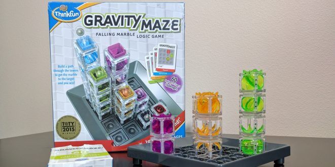 Gravity Maze board with three towers and the Gravity Maze box in the background