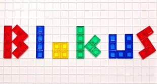 The word blokus spelled out in colored letters using Blokus game pieces on the Blokus game board