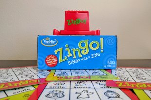 Zingo game with board tiles underneath